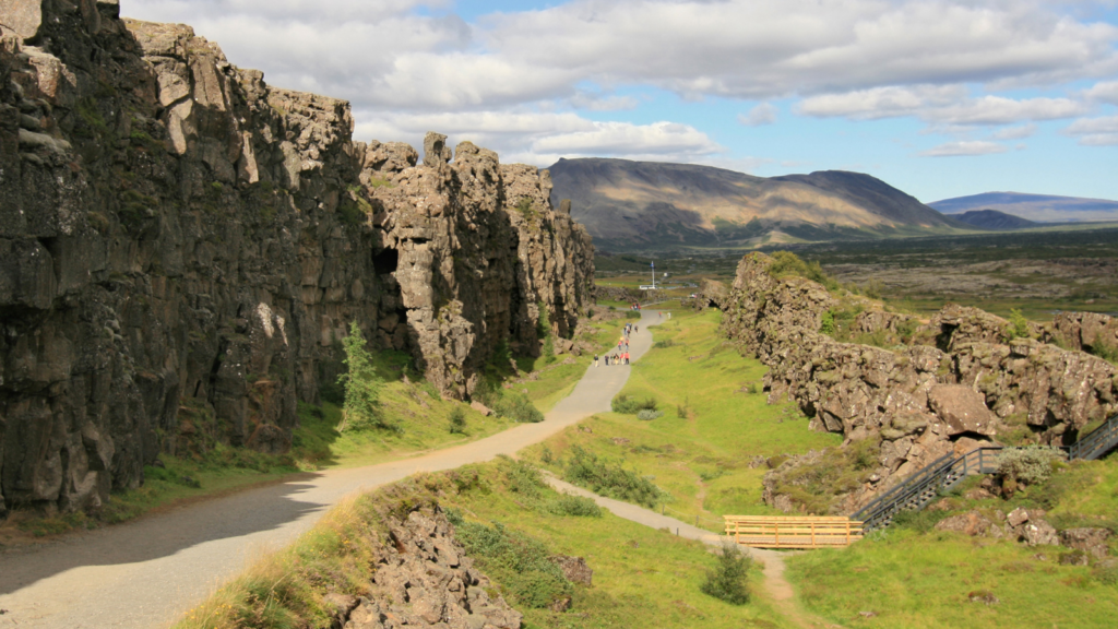 Sunny paved path through Thingvellir National Park, Iceland