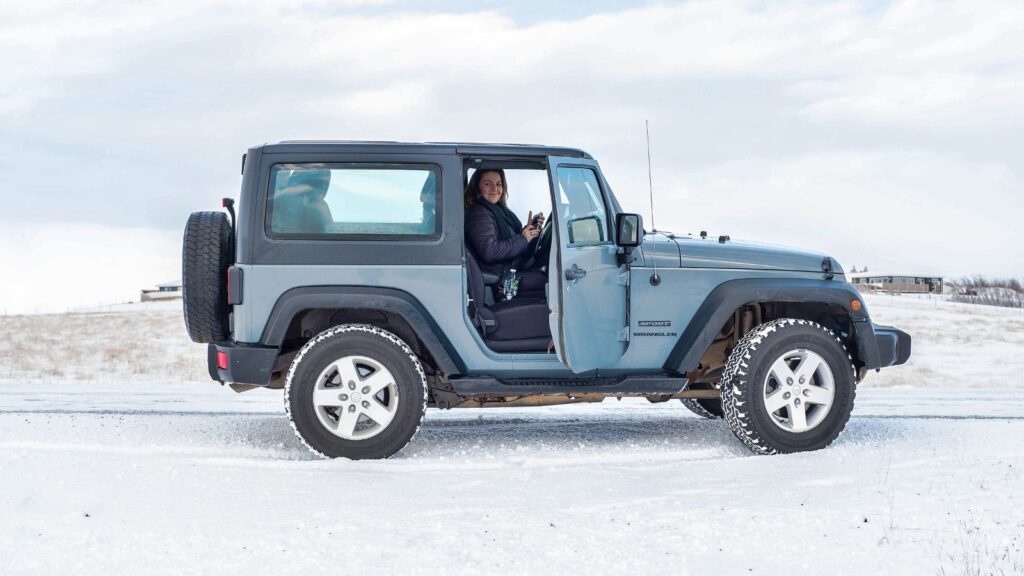 A woman driving through the south of Iceland